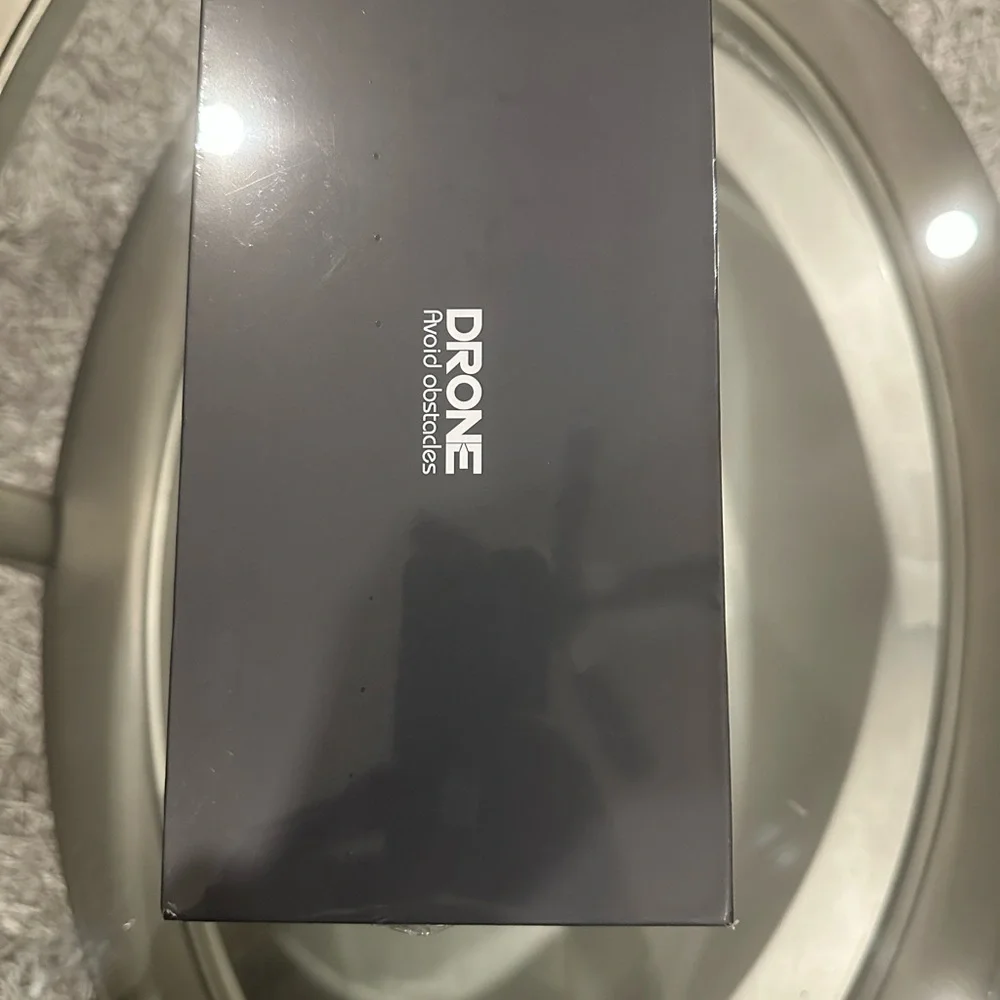 Sleek Black Drone with Advanced Obstacle Avoidance